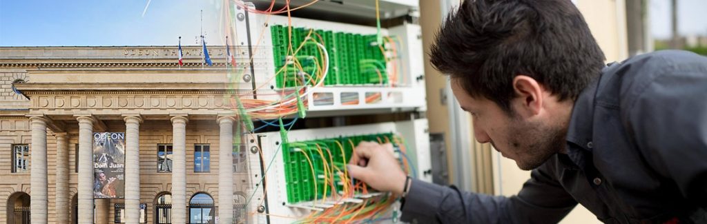 Topologie réseau — switch PoE fibre optique central relié aux 8 switchs distribués via câbles OM3
